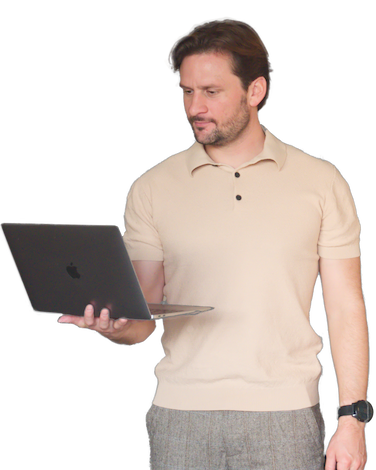 Portrait of Billy Nightingale looking at web design on laptop